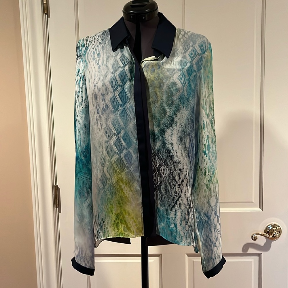 Elie Tahari long sleeved shear woman’s blouse.
